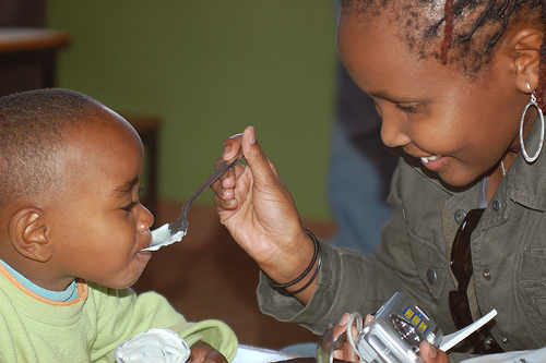 Afromusing feeds a child