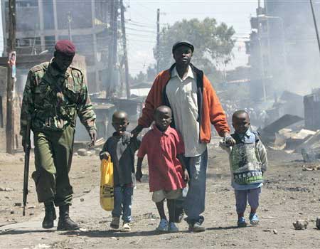 Police Escort a Family out of the Slums