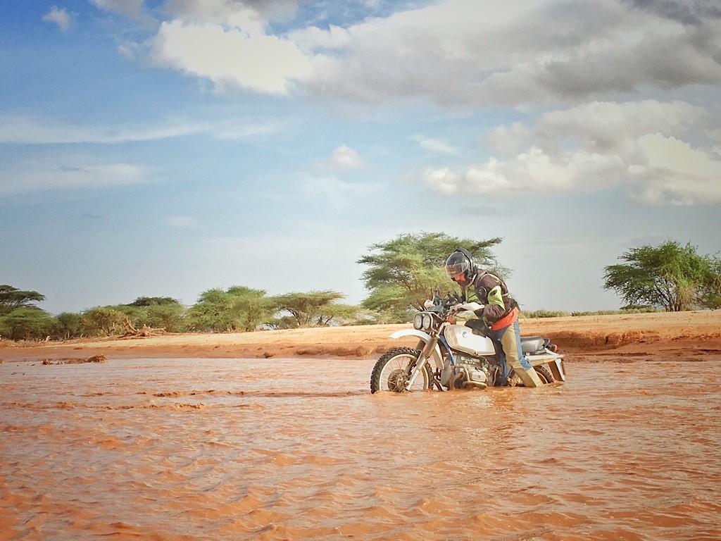 Philip fording a sand river in Marsabit county